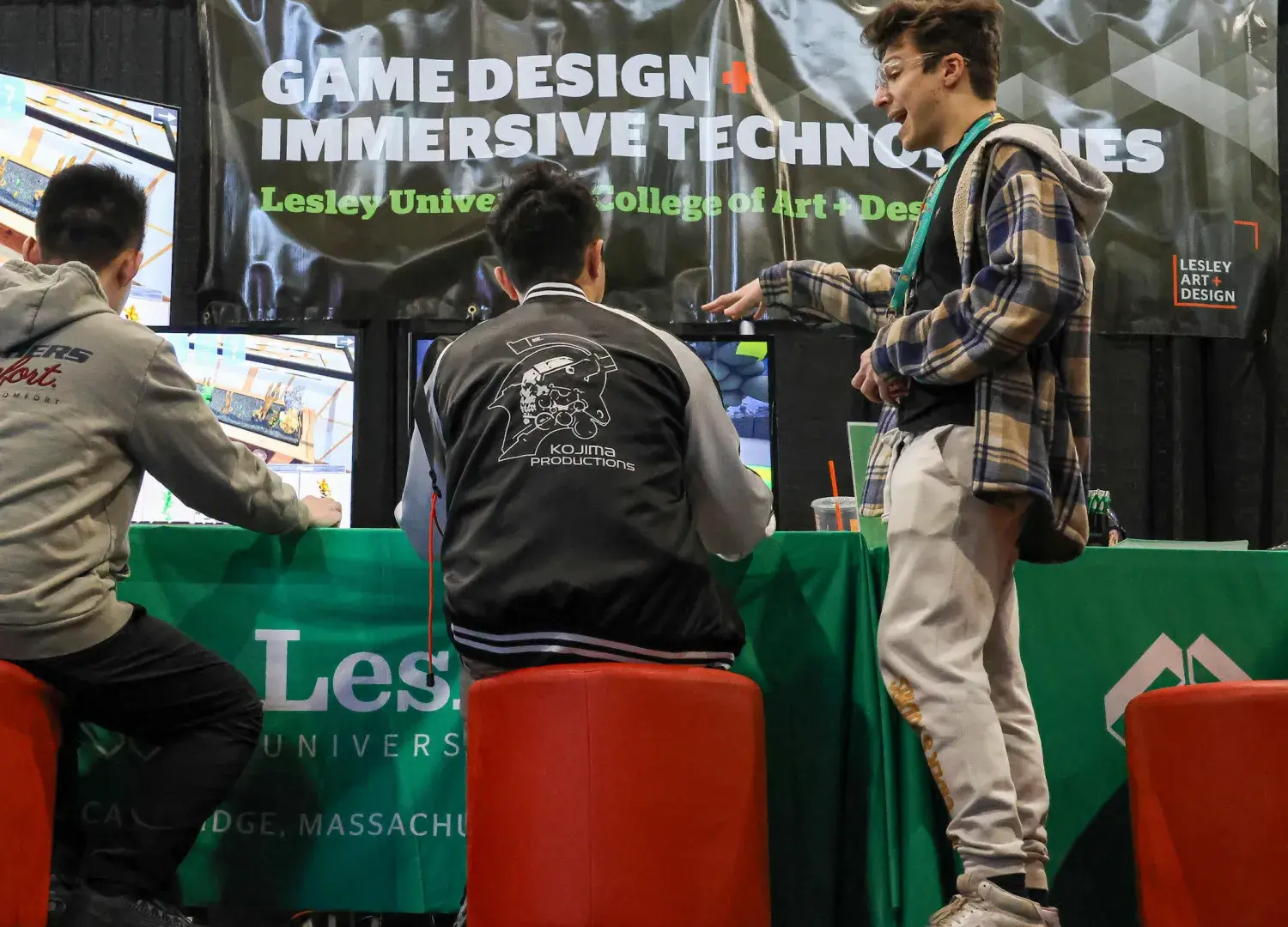 Student Jake Anderson shows PAX attendees a game built at Lesley