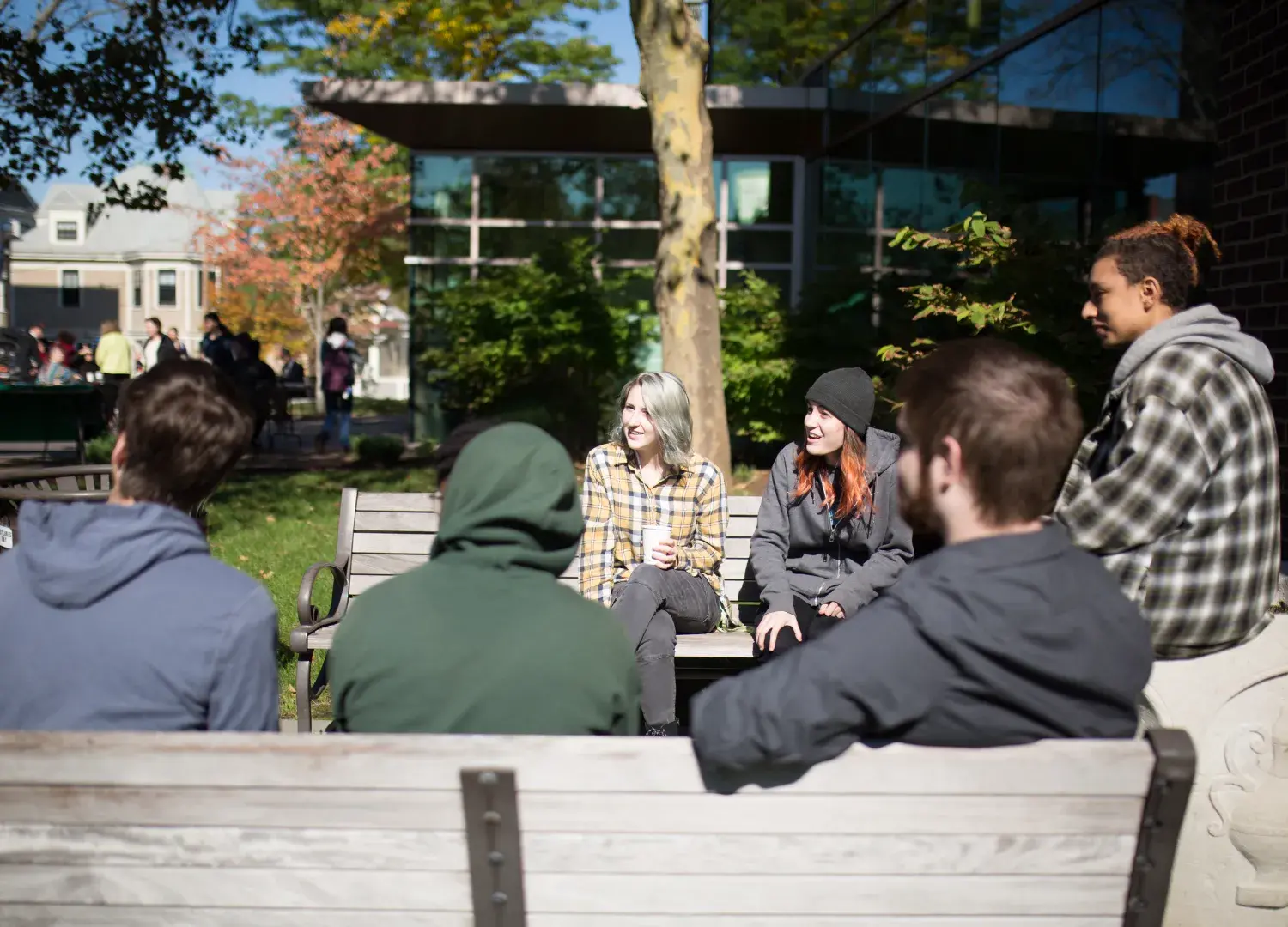 Students drinking coffee outside on the Lesley campus
