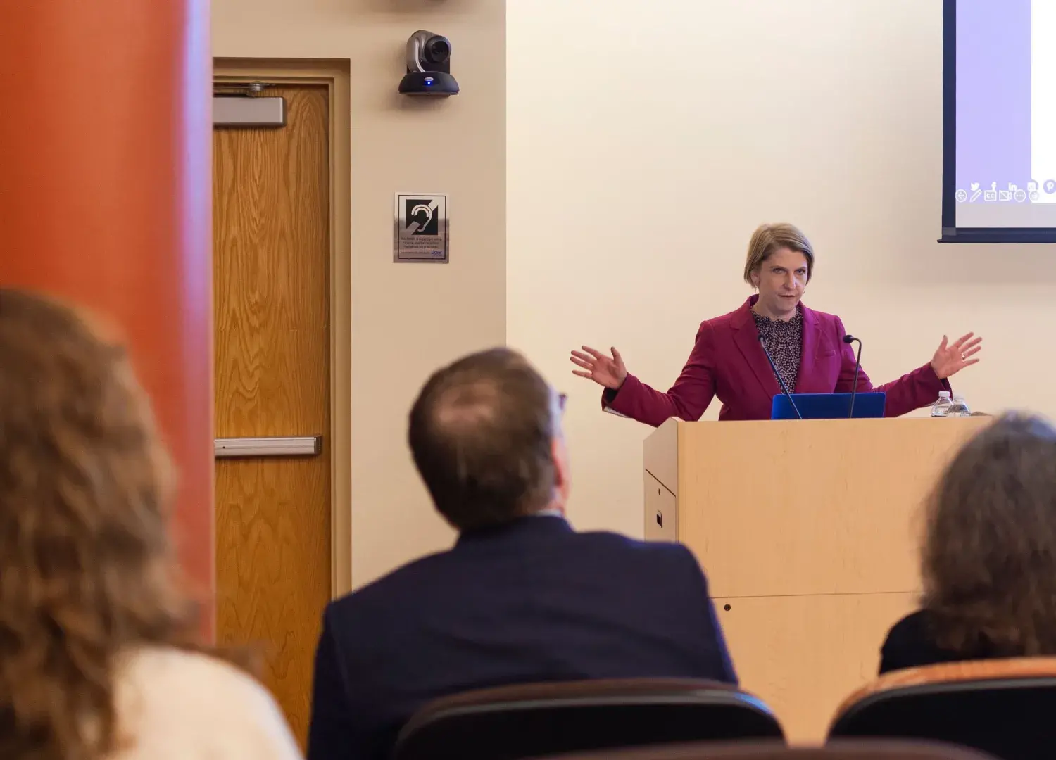 Lindsay Jones speaking at podium in University Hall Amphitheater
