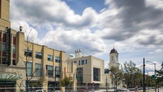 Exterior photo of Lunder Arts Center with clouds overhead.