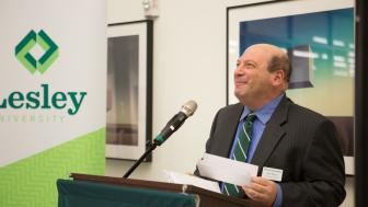 President Jeff Weiss at the podium at Lesley University