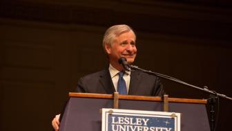 John Meacham speaks at a podium at the Boston Speaker Series.
