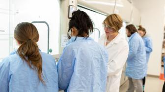 Assistant Professor Grace Ferris and Lesley students in the lab