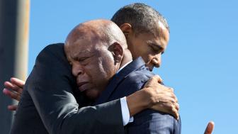 Barack Obama hugs John Lewis