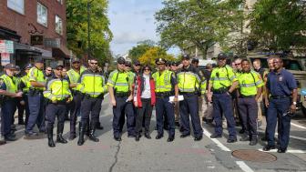  Denise Jillson, the Executive Director of HSBA, posing with Cambridge police.