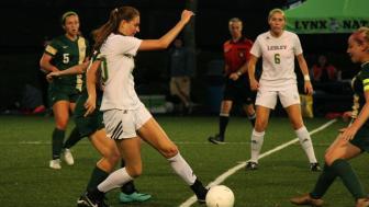 Lesley's womens soccer team playing in a match. 