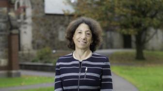 President Steinmayer wearing a striped blazer on Brattle Campus