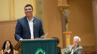 Jose Mendoza standing at a podium