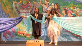 Judge Torres on stage with the mythical person behind her
