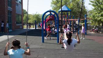 Kids swinging on a school playground