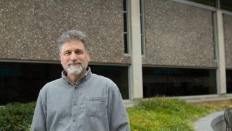 Professor Mitchell Kossak in front of Sherrill Library.