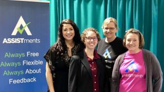From left: Dr. Hilary L. Kreisberg, director of Lesley University’s Center for Mathematics Achievement; Tina Cardone, the center’s assistant director; Cristina Heffernan, co-founder of ASSISTments; and Cindy Starks, director of user experience, training and visibility. They stand by a sign that reads ASSISTments: Always Free Always Flexible Always About Feedback