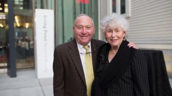 Peter and Paula Lunder pose in front of the Lunder Arts Center