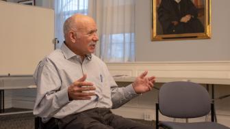 Reece Erlich speaking at Lesley