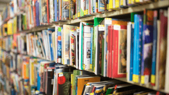 Colorful childrens books on a shelf