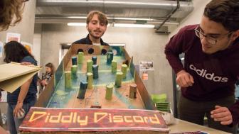 People look at the Plinko-esque "Diddly Discord."