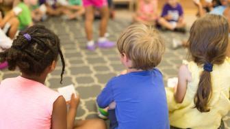 Children sitting in a circle on the floor