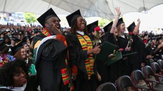 Students standing up and whooping