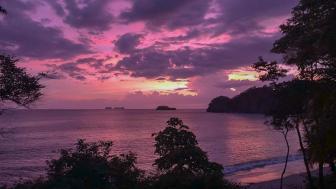 A purple sunset on the beach