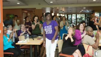 Regina Meadows, executive administrative assistant in the College of Liberal Arts and Sciences, is recognized during Lesley’s retirement celebration at the Student Center