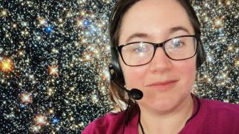 Photo of Giuliana Funkhouser wearing gaming headset in front of starry background