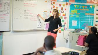 High school teacher in front of the classroom 