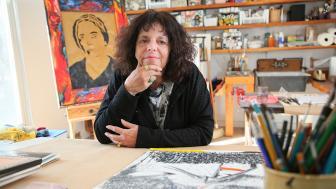 A photo of Expressive Therapies Professor Karen Frostig in an art studio.