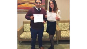 Two students receiving awards