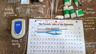 Flatlay of lab kits with each item labeled