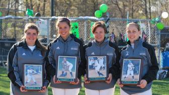 Molly Sarson, Jessica Guevara, Emily Mangiaratti and Rian Powers hold their softball plaques