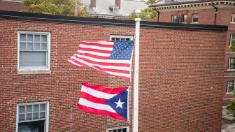 The Puerto Rico flag flies below the American flag on campus.