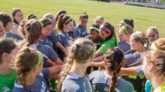 women's soccer team huddle