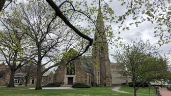 St. John's Chapel with tree limbs in the forefront.