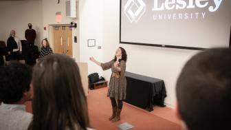 Laura Sánchez leads audience members through a movement exercise
