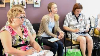 Members of the Russian delegation listen to a presentation on the Threshold Program.