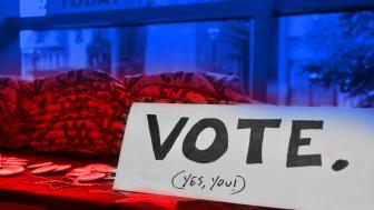 red white and blue photo with written vote yes you sign