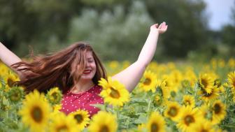 Zandra Matthews amid flowers