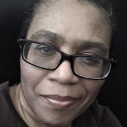 Photograph of Donna Owens smiling facing the camera