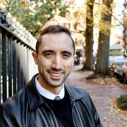 faculty member giuseppe formato smiling on the streets of cambridge