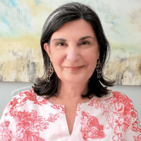 Headshot photograph of Yasemin Isler smiling at the viewer. 
