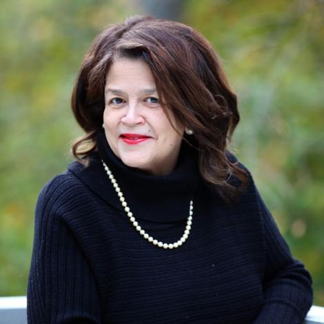 Headshot of Cheryl D. Miller smiling.