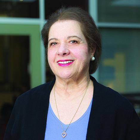 Professor Irene Fountas in blue shirt and black jacket.