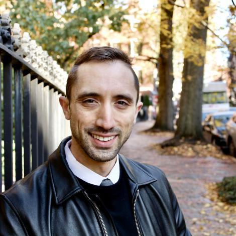 faculty member giuseppe formato smiling on the streets of cambridge