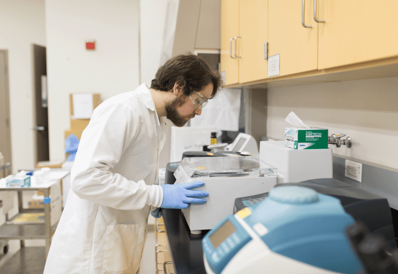 Biology student working in a lab.