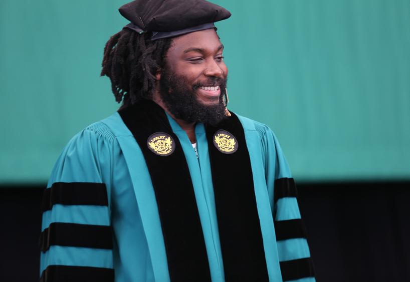 Jason Reynolds in regalia at Commencement 2018