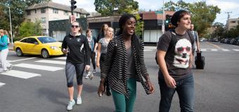 Lesley students walking across Massachusetts Avenue.