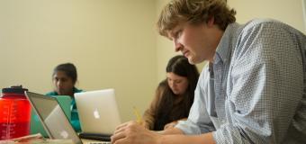Lesley student working on a laptop. 