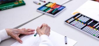 elderly hands with pastels