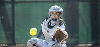 Lesley softball athlete catching ball