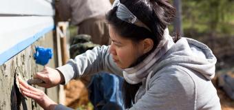 Lesley University fine arts student working on outdoor installation art project